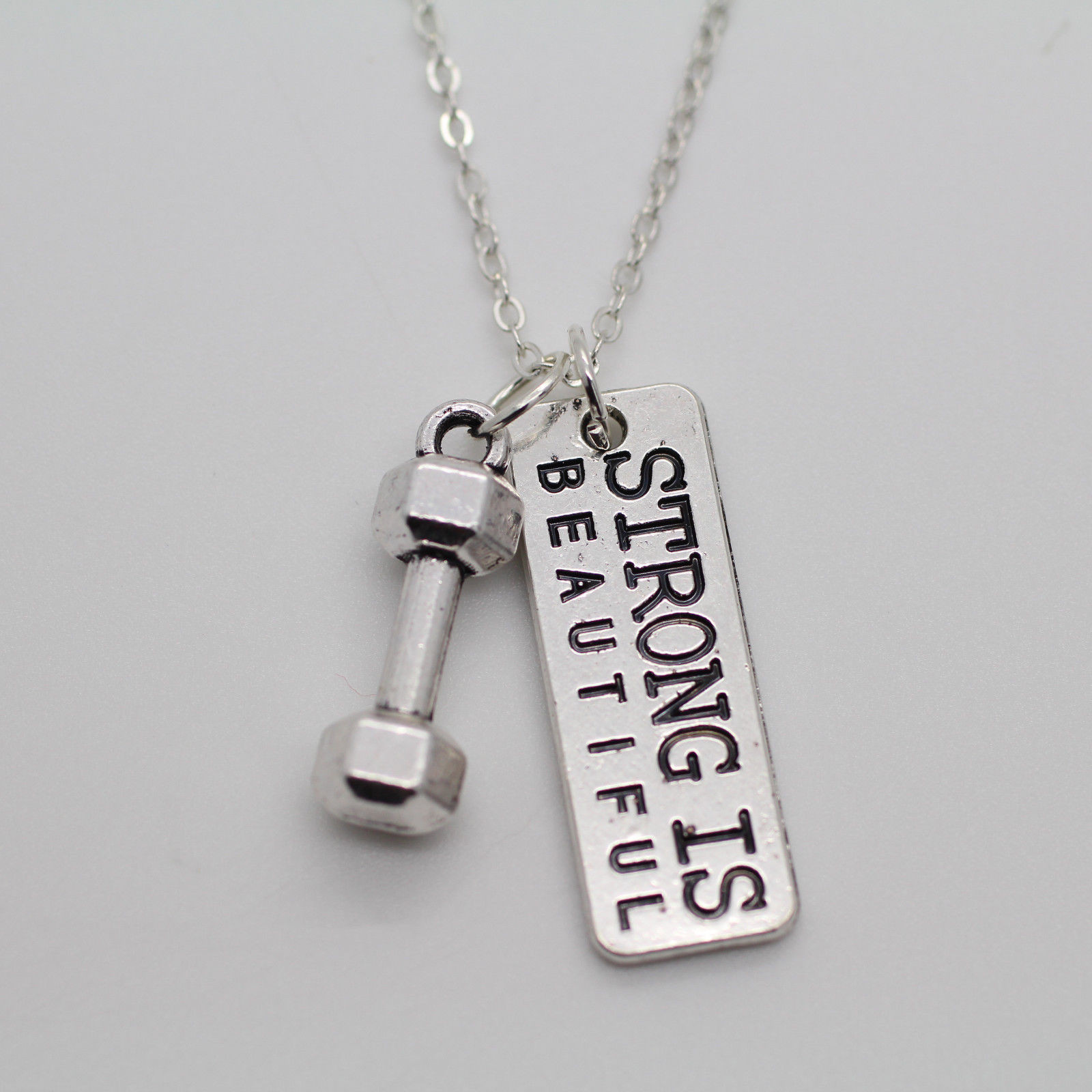 "Strong Is Beautiful" Dumbbell Charm Necklace